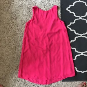 Bright pink dress with bow detail.